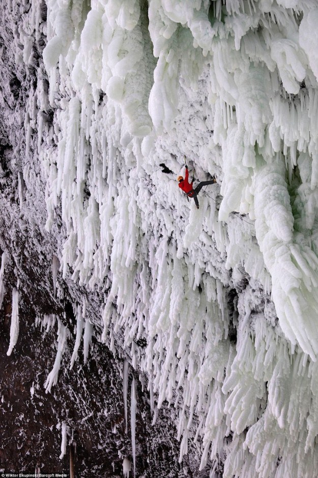ice climbing a frozen waterfall
